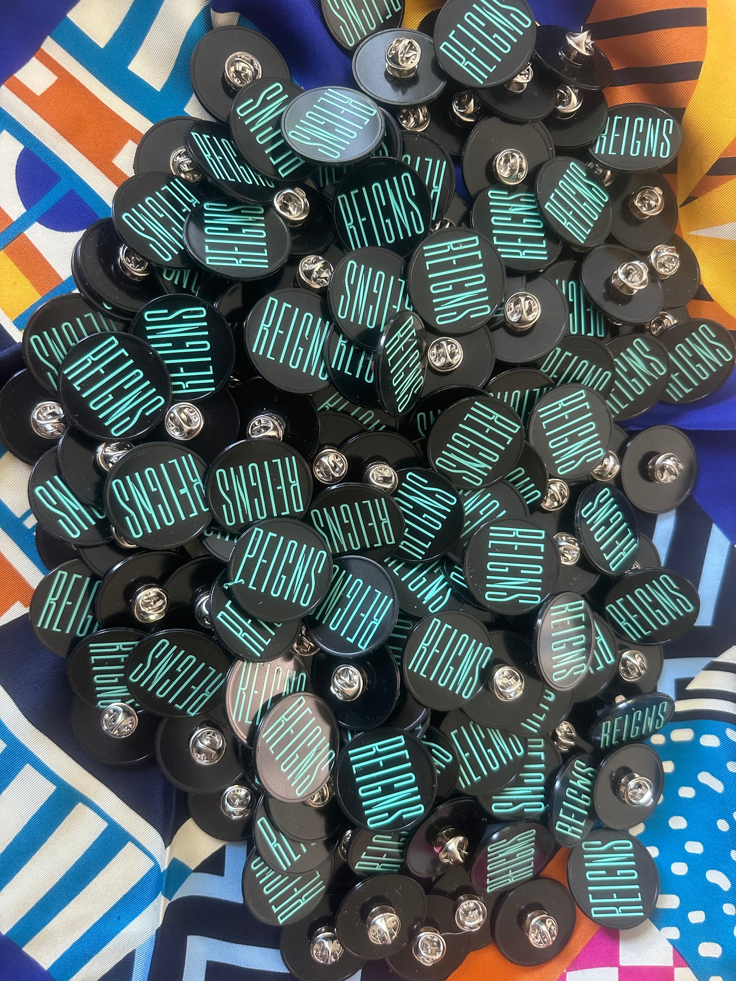 REIGNS Badge